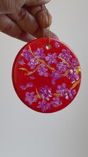 Load and play video in Gallery viewer, Hand painted orange Christmas ornament wit pink cherry blossoms
