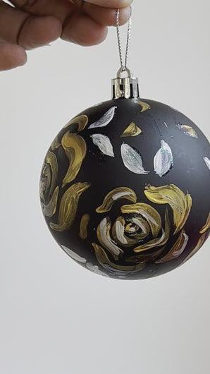 Gold Floral artwork on black Christmas ornament